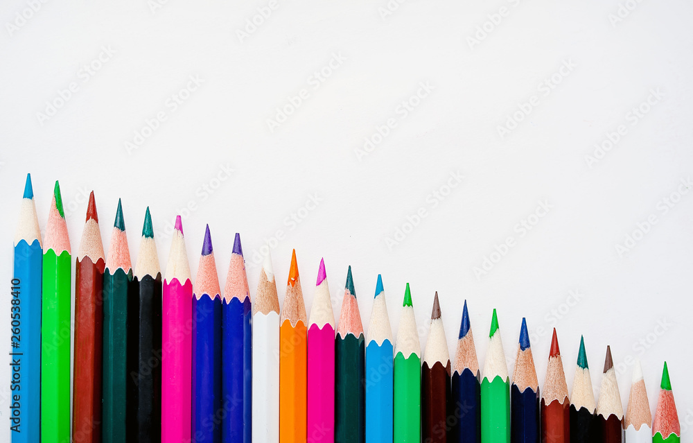 Colored pencils on a white background, with space for your text, blank for banner Colored pencils on a white background, with space for your text, blank for banner