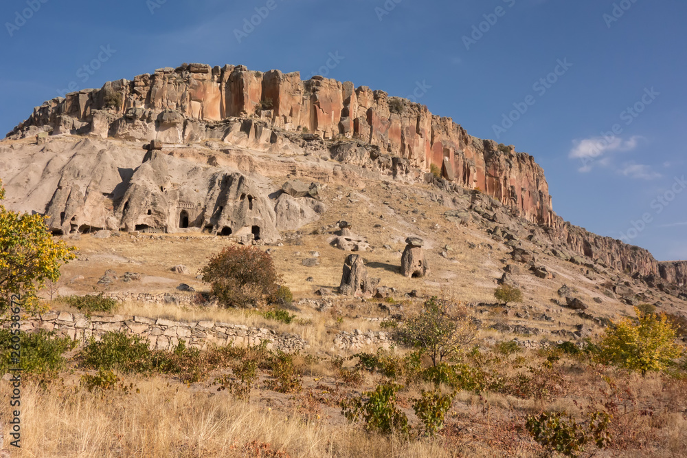 Fototapeta premium View of Cappadocia. Turkey. A geological formation consisting of volcanic tuff with cave dwelling. Cave monastery in Goreme Central Anatolia.
