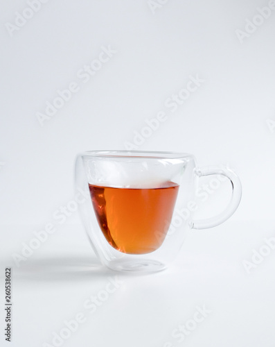 Cup Hot black tea, front view isolated on white background.