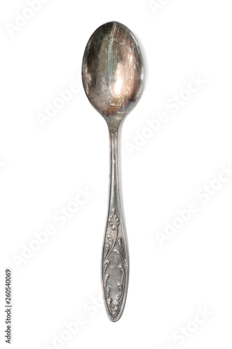 Old teaspoon with ornament on white isolated background