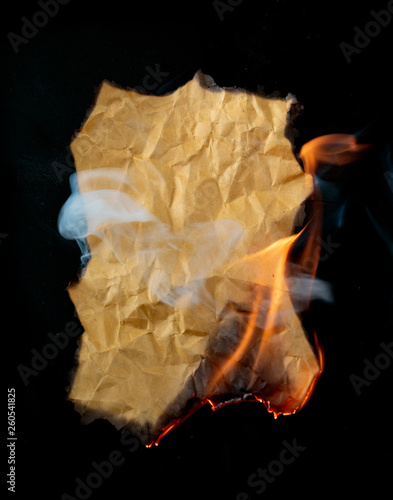 .burning piece of crumpled paper