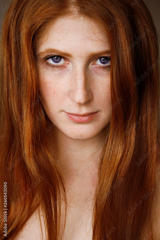portrait of red-haired girl with freckles portrait of red-haired girl with freckles