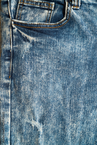 Close up of blue denim jeans fabric texture background.