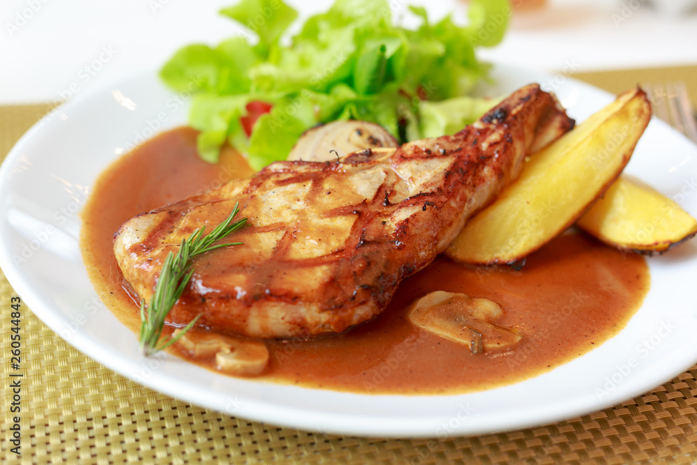grilled pork chop with vegetable on disk grilled pork chop with vegetable on disk