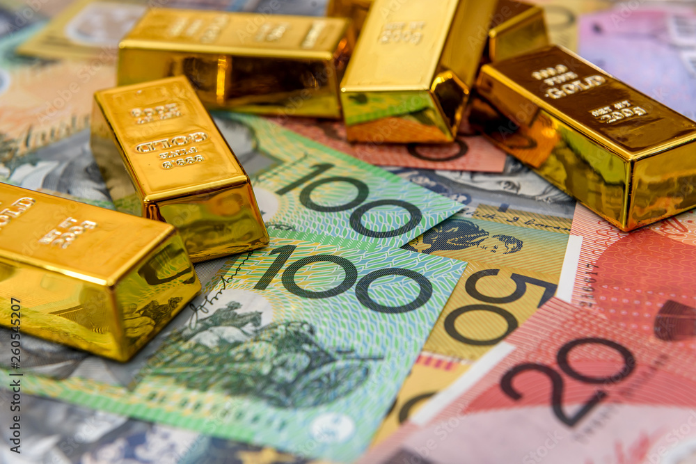 Ingot on colorful australian dollar banknotes closeup Ingot on colorful australian dollar banknotes closeup