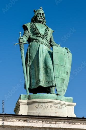 Photography Hungary, Budapest, Hosok tere: Statue of Charles I, King Ladislaus IV as part of the left colonnade at famous Heroes' Square in the city center of the Hungarian capital with blue sky in background