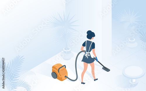 Maid in Uniform Vacuuming Floor in Hotel Hallway