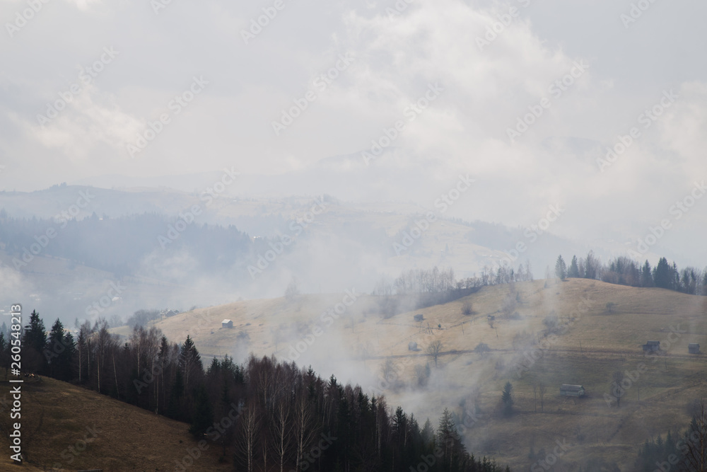 Fototapeta premium Foggy mountains are a picturesque landscape