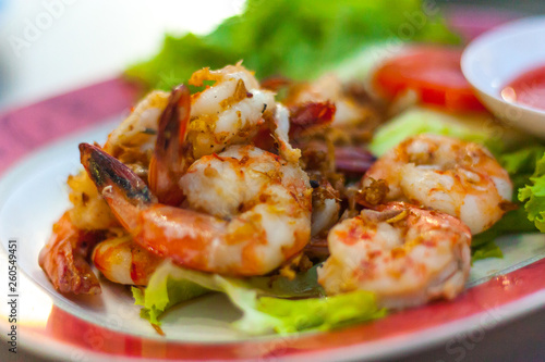 Thai food famous menu "Goong Tod Kra Thiam Phrik Thai" or Stir fried shrimp with garlic. Thai food.