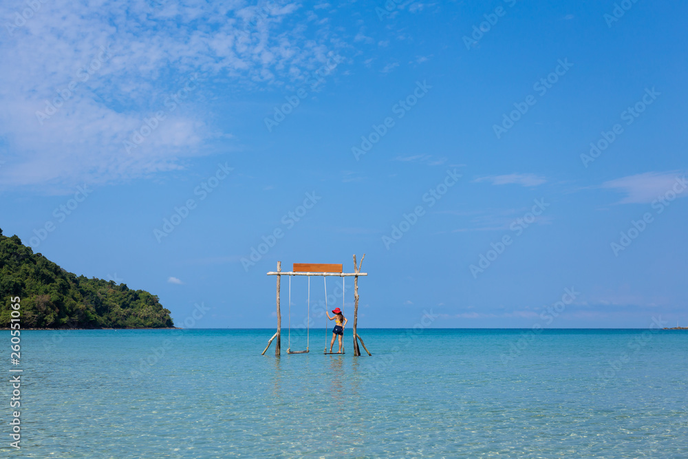 Summer travel Back view of young woman on the beach at Sea, koh kood island Thailand Summer travel Back view of young woman on the beach at Sea, koh kood island Thailand