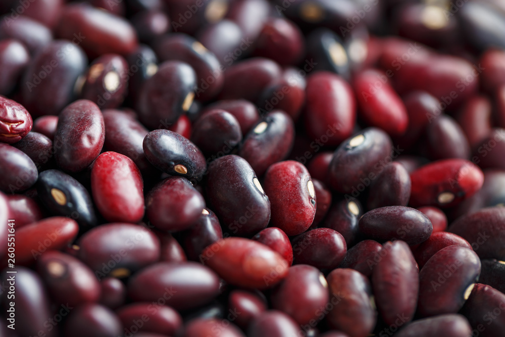 Closeup of a grain of red bean seeds. The texture of the legumes. Close up red beans background, seeds of red beans Closeup of a grain of red bean seeds. The texture of the legumes. Close up red beans background, seeds of red beans