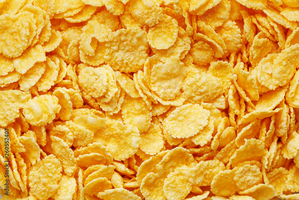 Golden cornflakes background and texture. View from above. cornflakes healthy breakfast Golden cornflakes background and texture. View from above. cornflakes healthy breakfast