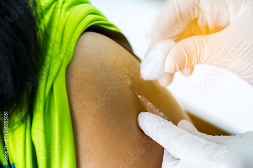 Hand of doctor inject vaccine solution in intradermal