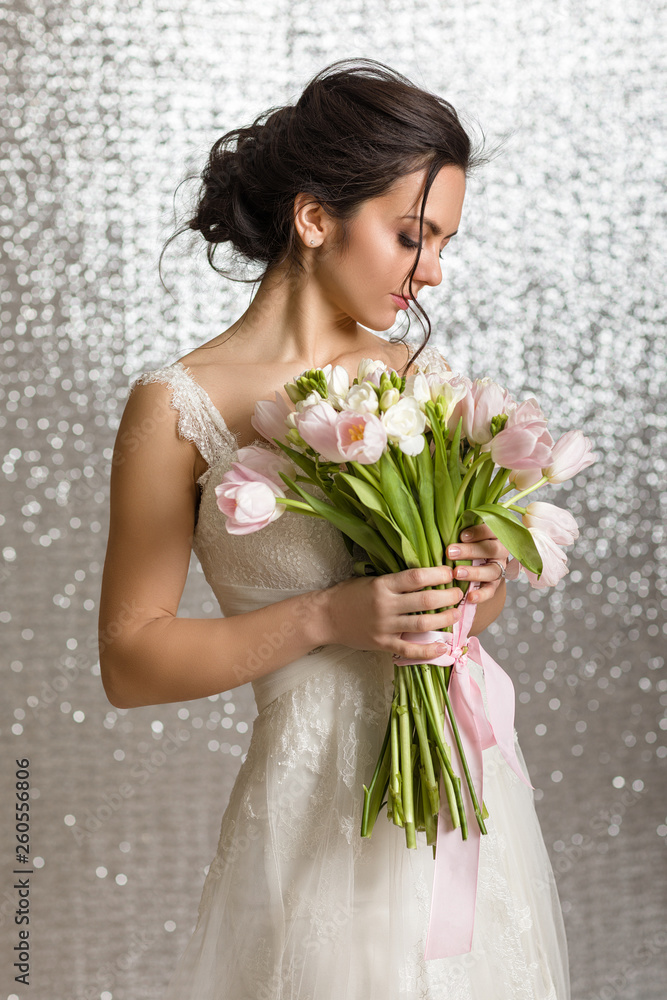Portrait of beautiful bride with wedding bouquet of pink tulips Portrait of beautiful bride with wedding bouquet of pink tulips