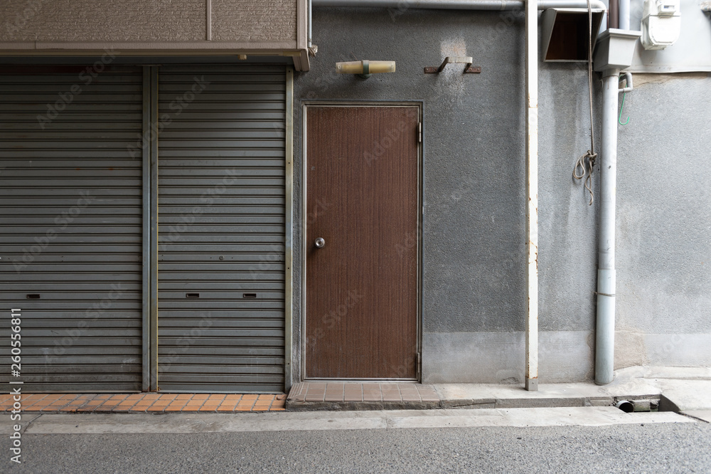 Fototapeta premium sidewalk by street wall & door