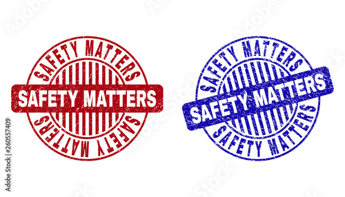 Grunge SAFETY MATTERS round stamp seals isolated on a white background. Round seals with grunge texture in red and blue colors.