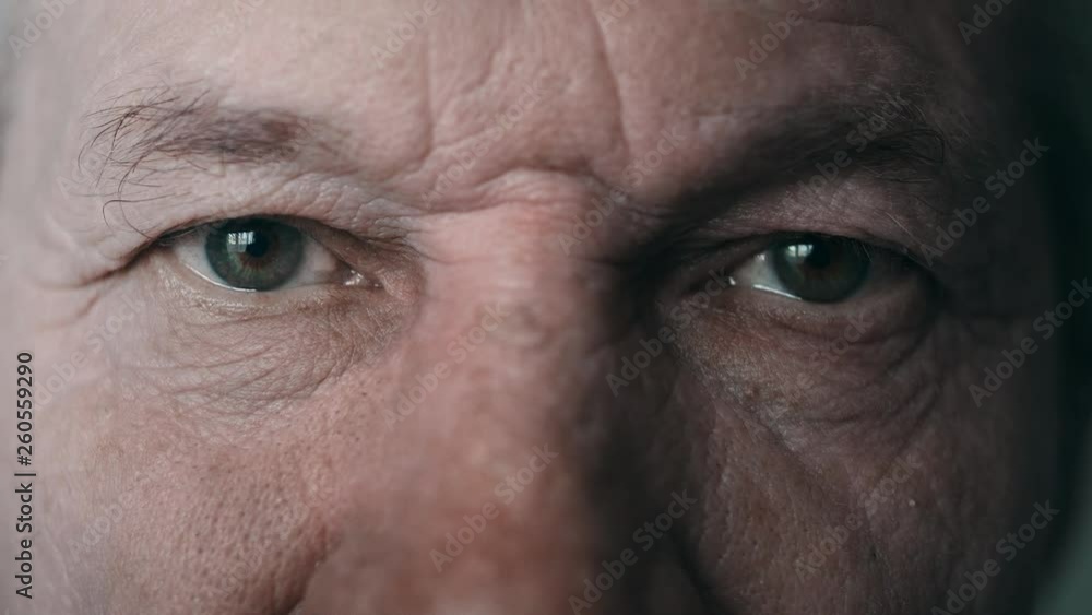 Close-up portrait of an old man. Eyes of an elderly man close-up. A grown man looks at the camer. Cool color, slow motion. 4K Close-up portrait of an old man. Eyes of an elderly man close-up. A grown man looks at the camer. Cool color, slow motion. 4K
