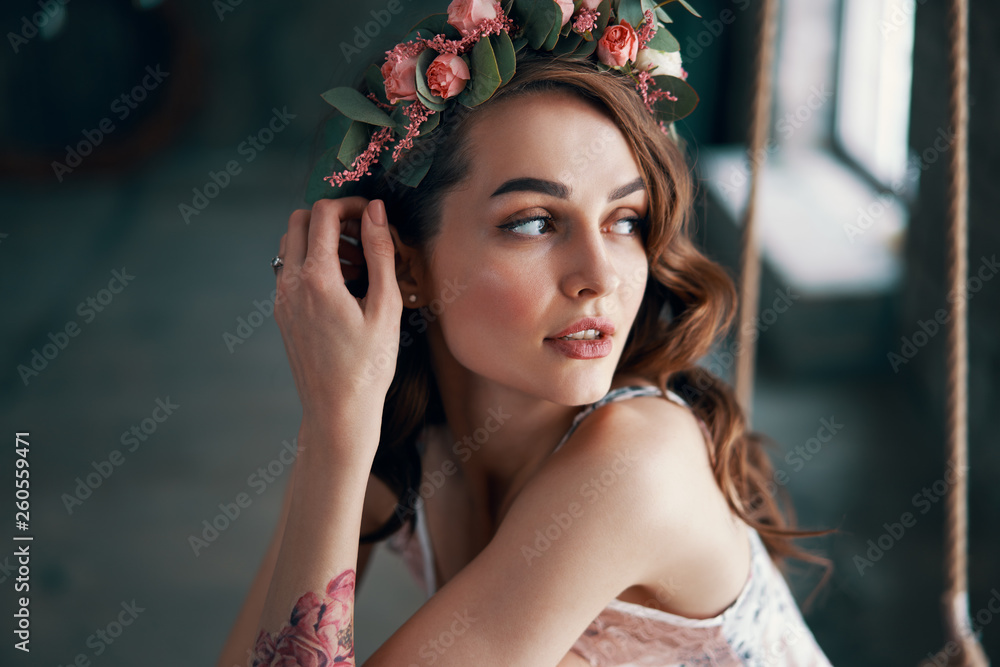 Fototapeta premium Sensual beautiful woman portrait with wreath of flowers in her hair