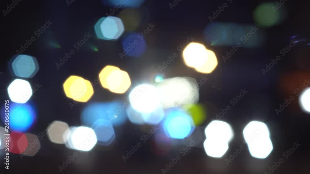 Abstract bokeh background in blue, white, yellow, green and orange colours. Night city blurred out of focus spot lights. Abstract bokeh background in blue, white, yellow, green and orange colours. Night city blurred out of focus spot lights.