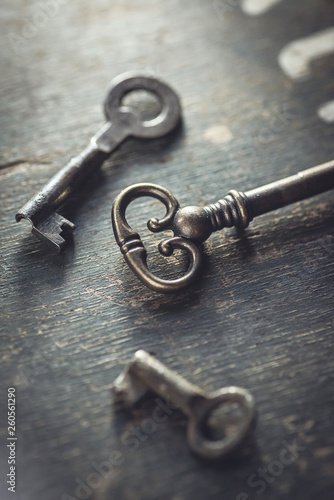 Shallow DOF. Set of vintage worn out keys on a wooden background. © Room 76 Photography