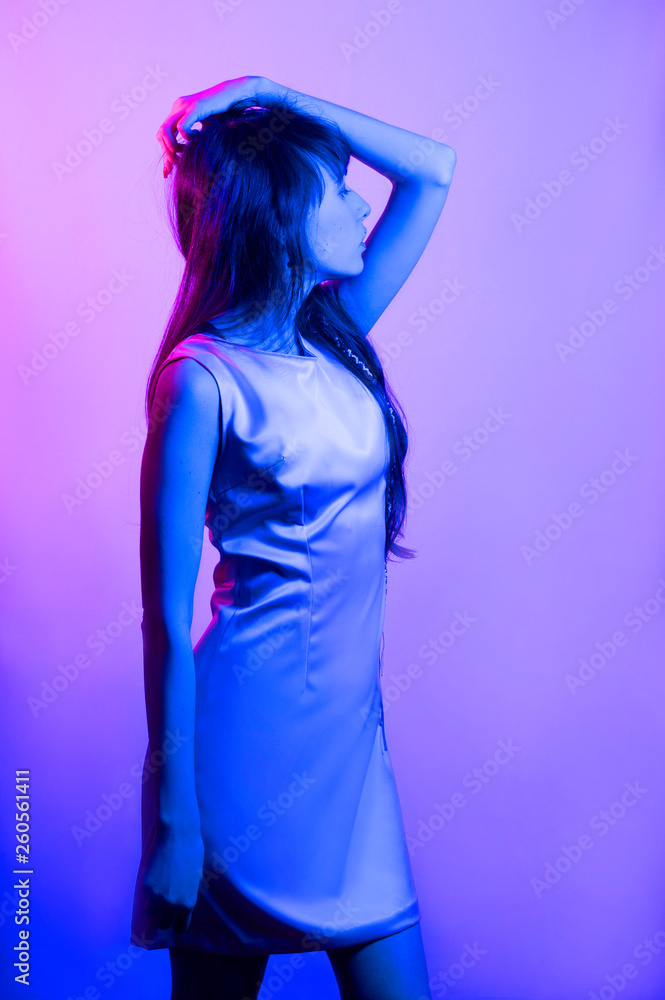 girl on a colored background in blue light
