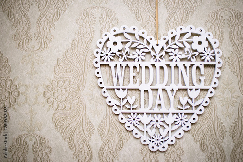 Lettering the wedding day with white wooden letters. Background for the wedding day