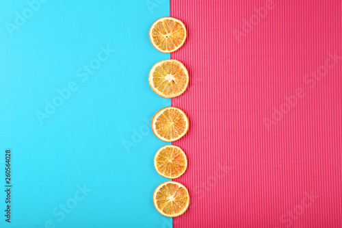Dried orange fruits on colorful background