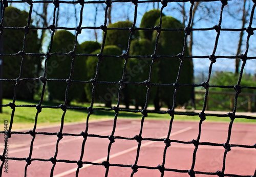 tennis net that blocks the passage and the view