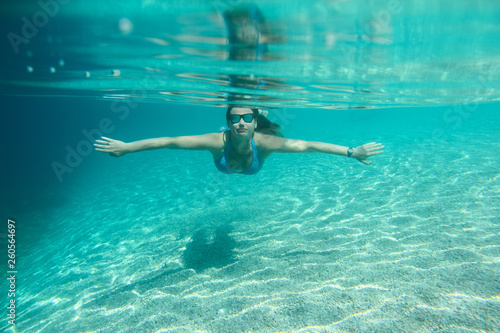 Woman diving swimming underwater view