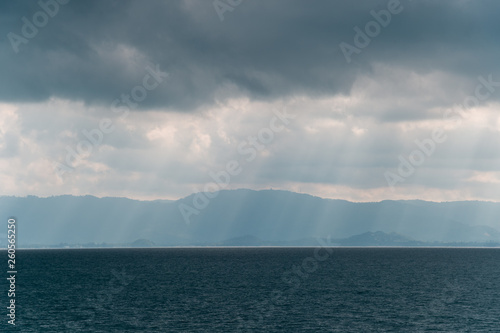beautiful sun's rays over the sea © pariwatpannium
