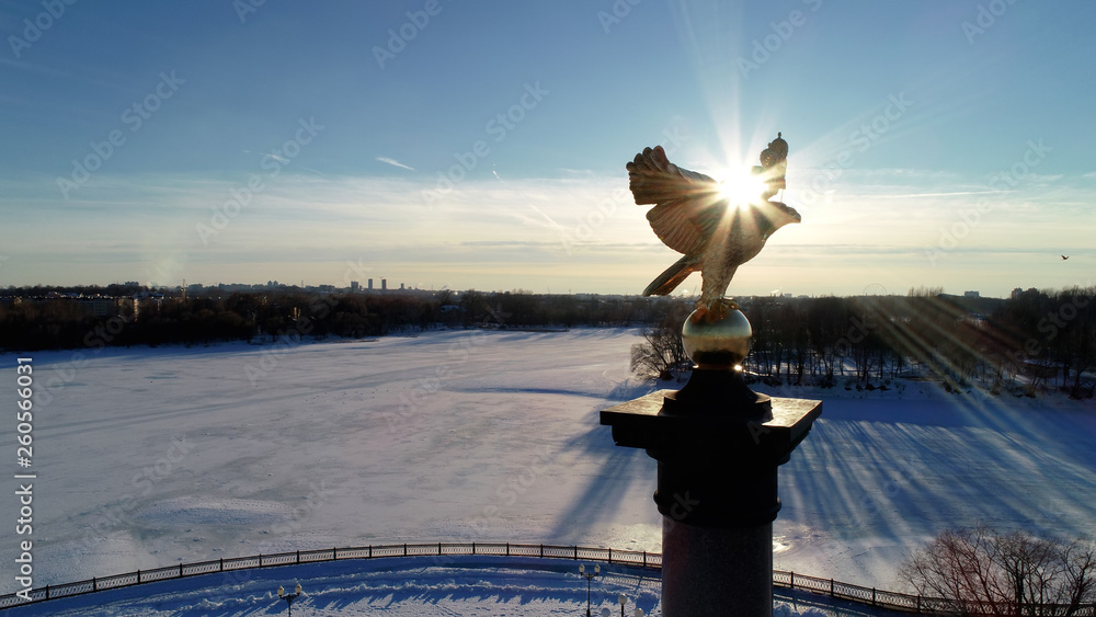 Φωτογραφία Stella with the figure of an eagle in the rays of the sun on the background of t