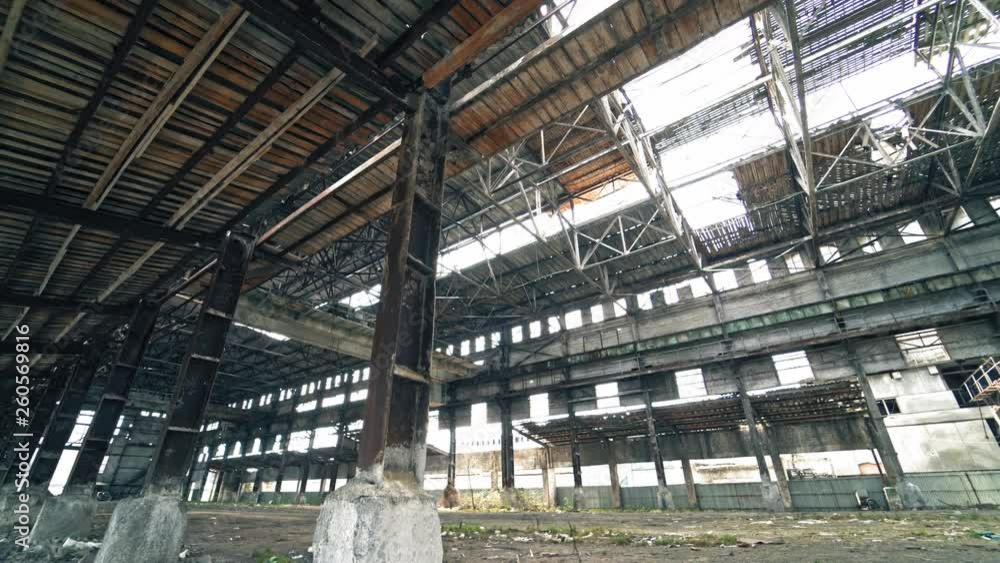 Inside old ruined building with collapsed roof and overgrown with grass, catastrophe or earthquake consequences, toned Inside old ruined building with collapsed roof and overgrown with grass, catastrophe or earthquake consequences, toned