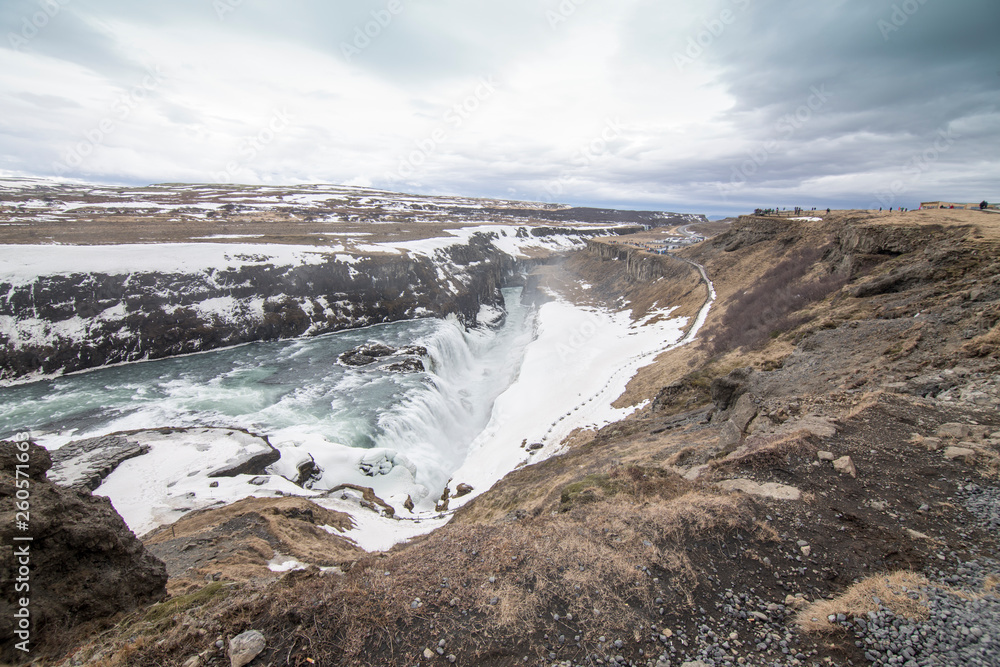 Amazing Icelandic winter landscape of majestic waterfall of frozen Gullfoss