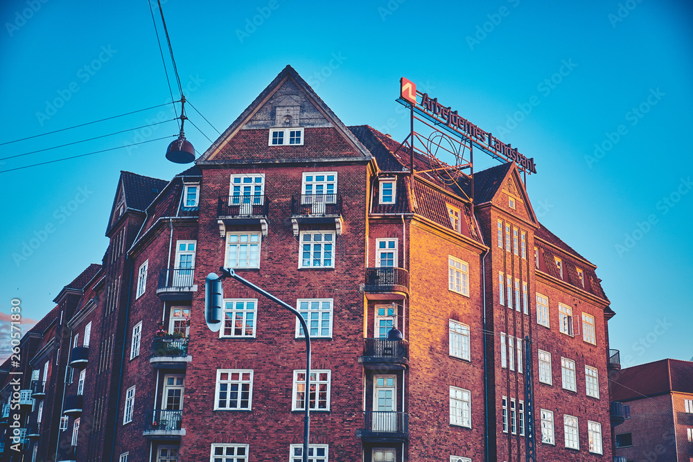 Fototapeta premium Denmark, Copenhagen - June 30, 2018: Brick building during sunset