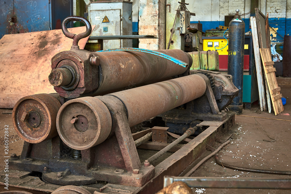 old rusty dirty machines and mechanisms in an abandoned factory