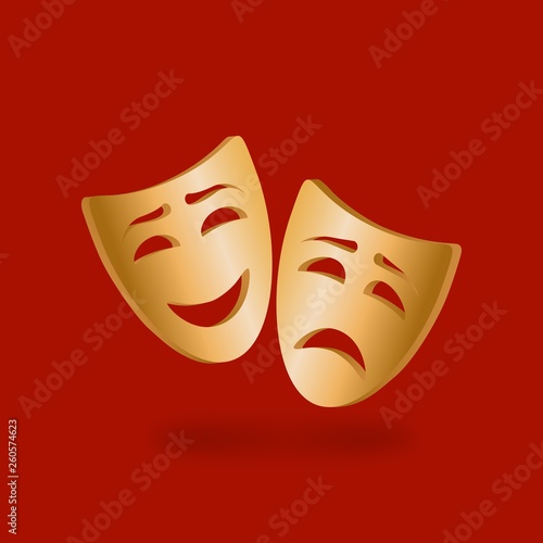 Golden theatrical masks of comedy and tragedy on red background