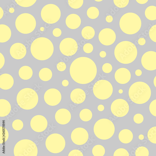 Chaotic vector pattern with circles. Modern seamless pattern with yellow circles. Dots abstract pattern. Cute pattern for wallpaper, fabric, wrapping paper.