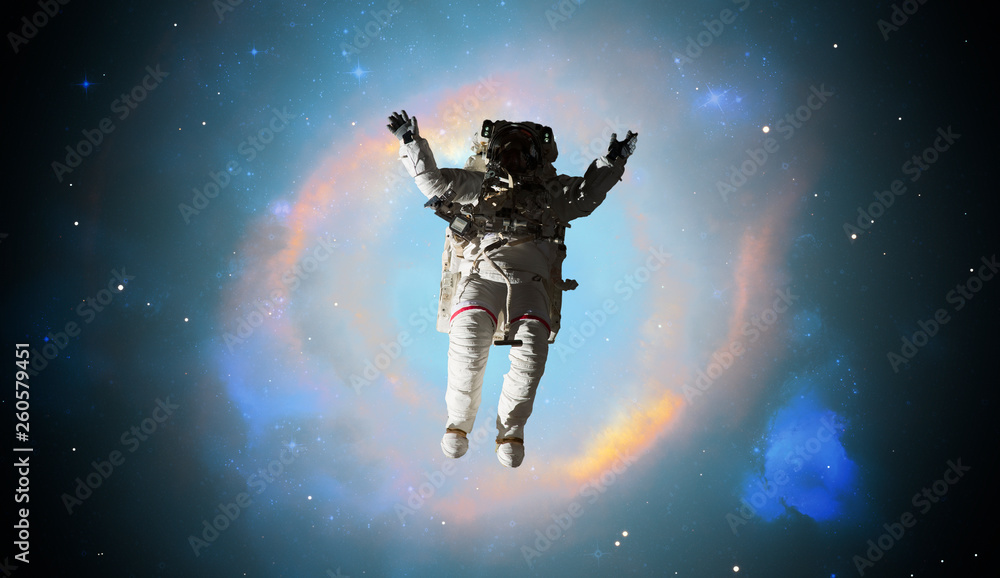 Fototapeta premium astronaut walking in outer space, elements of this image furnished by nasa b