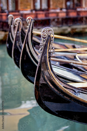 Gondolas in a Row in Canal in Venice