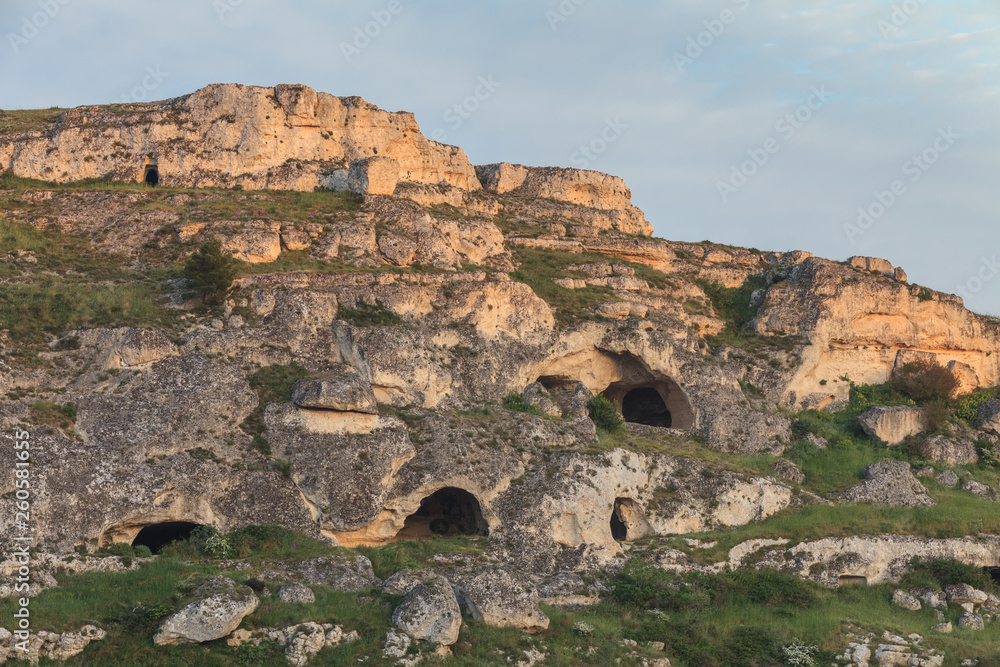 Caves on the side of the Gravina Canyon. Matera, Italy