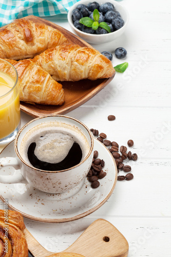 Coffee  juice and croissants breakfast