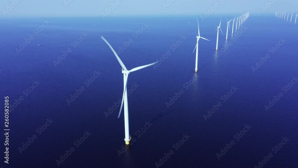 WindTurbines in a blue sea on a sunny day WindTurbines in a blue sea on a sunny day