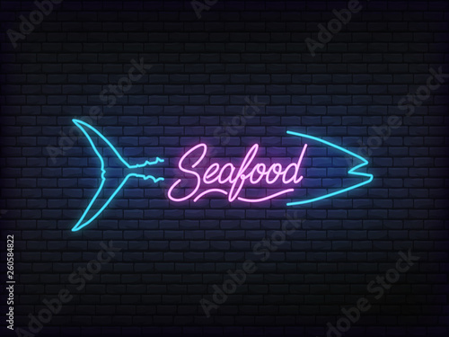 Seafood neon glowing sign. Bright vector label of fish and seafood lettering.