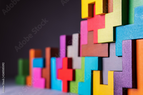 Geometric shapes on a wooden background.