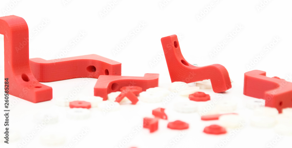 3d printing plastic part red isolated on white background, produced from pla, horizontal view, macro - obrazy, fototapety, plakaty 