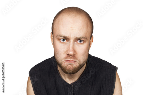 portrait of a bald upset offended man experiencing stress due to problems on an isolated white background
