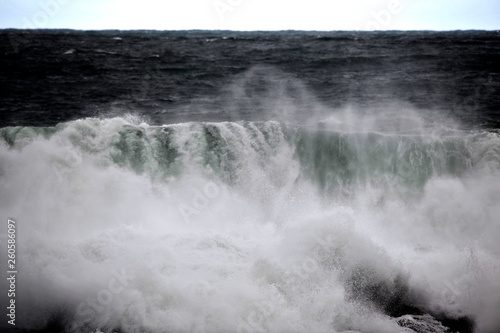 snapshot of a wave breaking in the sea 