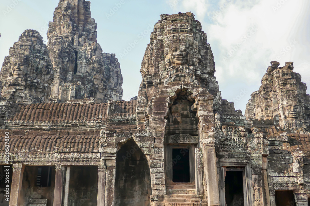 Stone faces on facade at Bayon Temple in Angkor Tom, Siem Reap, Cambodia