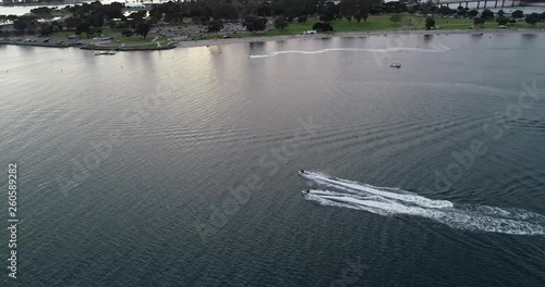 California bay: Jet skiers in the sunset photo