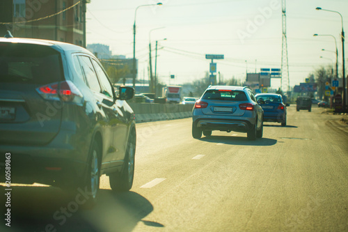 lurry and soft focus at many car on the main road. Copy space and Sunset Background. Driver perspective. Concept Holiday travel, Go back home , Missing home, Safety and dangerous on street